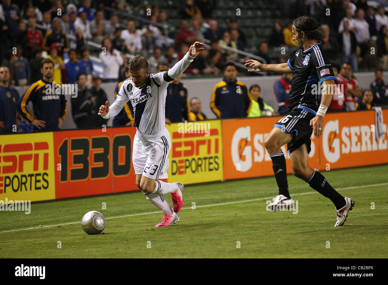 May 23, 2012 - Carson, California, United States of America - David Beckham (23) of Los Angeles Galaxy crosses the ball from the sideline against Alan Gordon (16) of San Jose Earthquakes in the second half during the Los Angeles Galaxy vs San Jose Earthquakes game at the Home Depot Center. The Earth Stock Photo