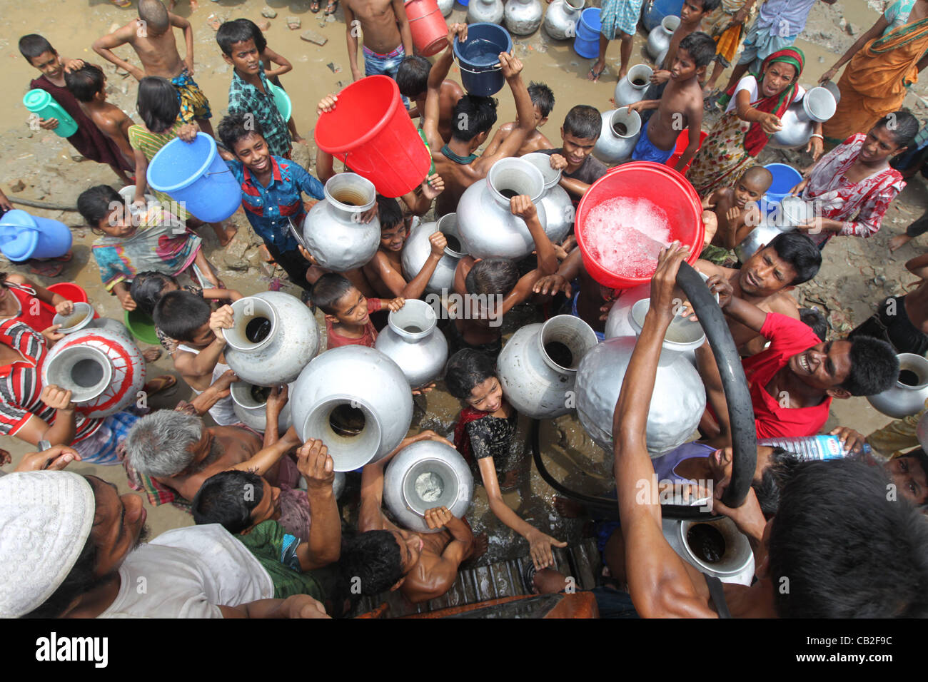 May 24, 2012 Dhaka, Bangladesh People gather to collect drinking