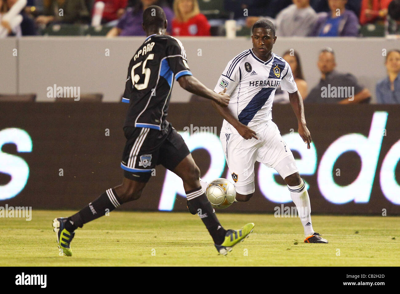May 23, 2012 - Carson, California, United States of America - Ike Opara (55) of San Jose Earthquakes rushes in to try to steal the ball from Edson Buddle (14) of Los Angeles Galaxy in the second half during the Los Angeles Galaxy vs San Jose Earthquakes game at the Home Depot Center. The Earthquakes Stock Photo