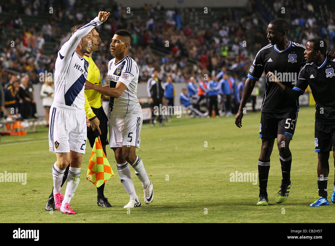 May 23, 2012 - Carson, California, United States of America - The referee and Sean Franklin (5) of Los Angeles Galaxy rushe in to break up a fight between David Beckham (23) of Los Angeles Galaxy and Marvin Chavez (81) of San Jose Earthquakes in the second half during the Los Angeles Galaxy vs San J Stock Photo