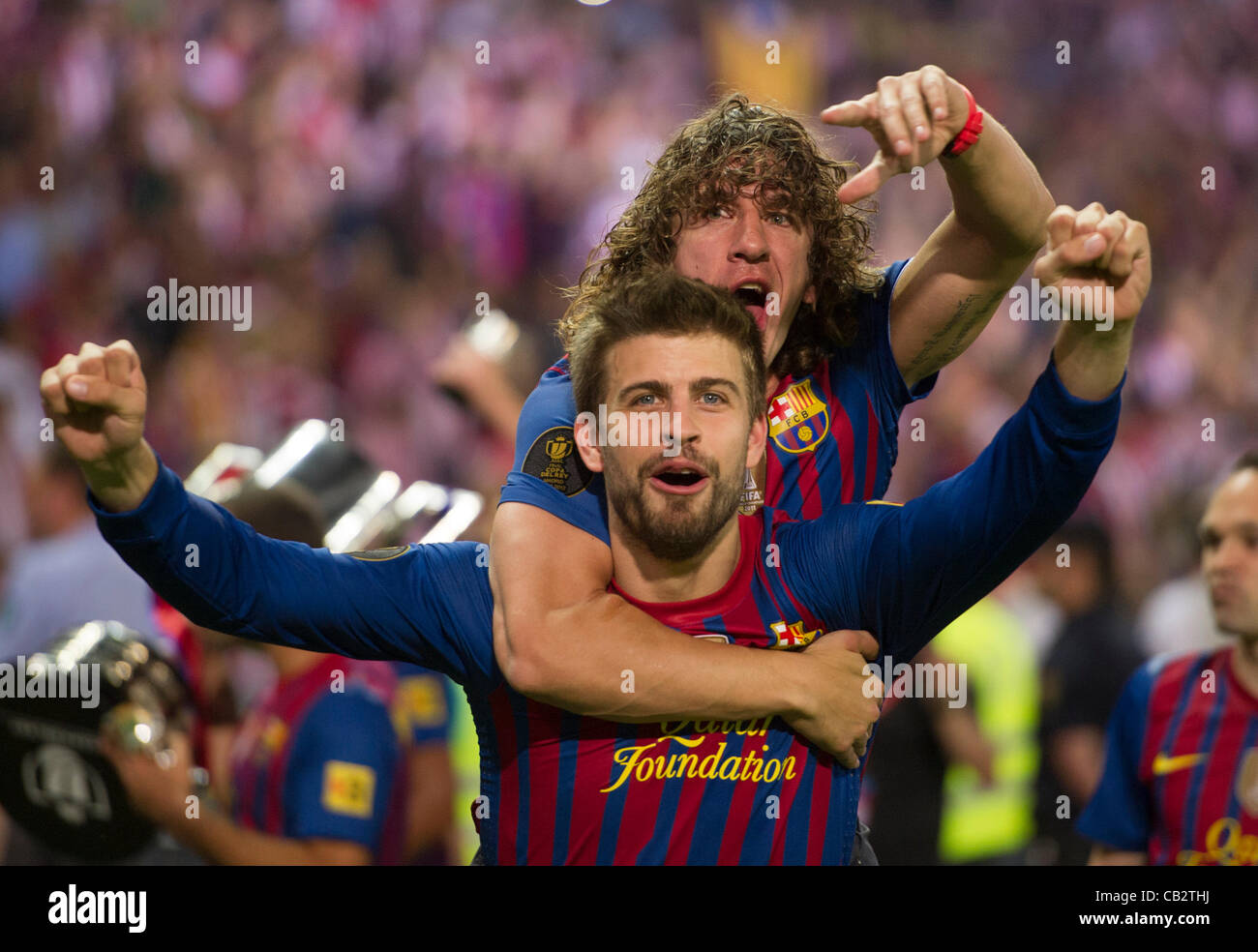 MADRID, SPAIN - MAY 25:  Gerard Pique and Carles Puyol from F.C.Barcelona,  celebrate after beating Athletic de Bilbao in the Copa del Rey Final for 3-0 at Vicente Calderon Stadium on May 25, 2012 in Madrid, Spain. (Credits : J.M.Colomo/GRUPPO) Stock Photo