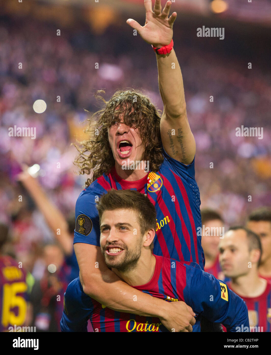 MADRID, SPAIN - MAY 25:  Gerard Pique and Carles Puyol from F.C.Barcelona,  celebrate after beating Athletic de Bilbao in the Copa del Rey Final for 3-0 at Vicente Calderon Stadium on May 25, 2012 in Madrid, Spain. (Credits : J.M.Colomo/GRUPPO) Stock Photo