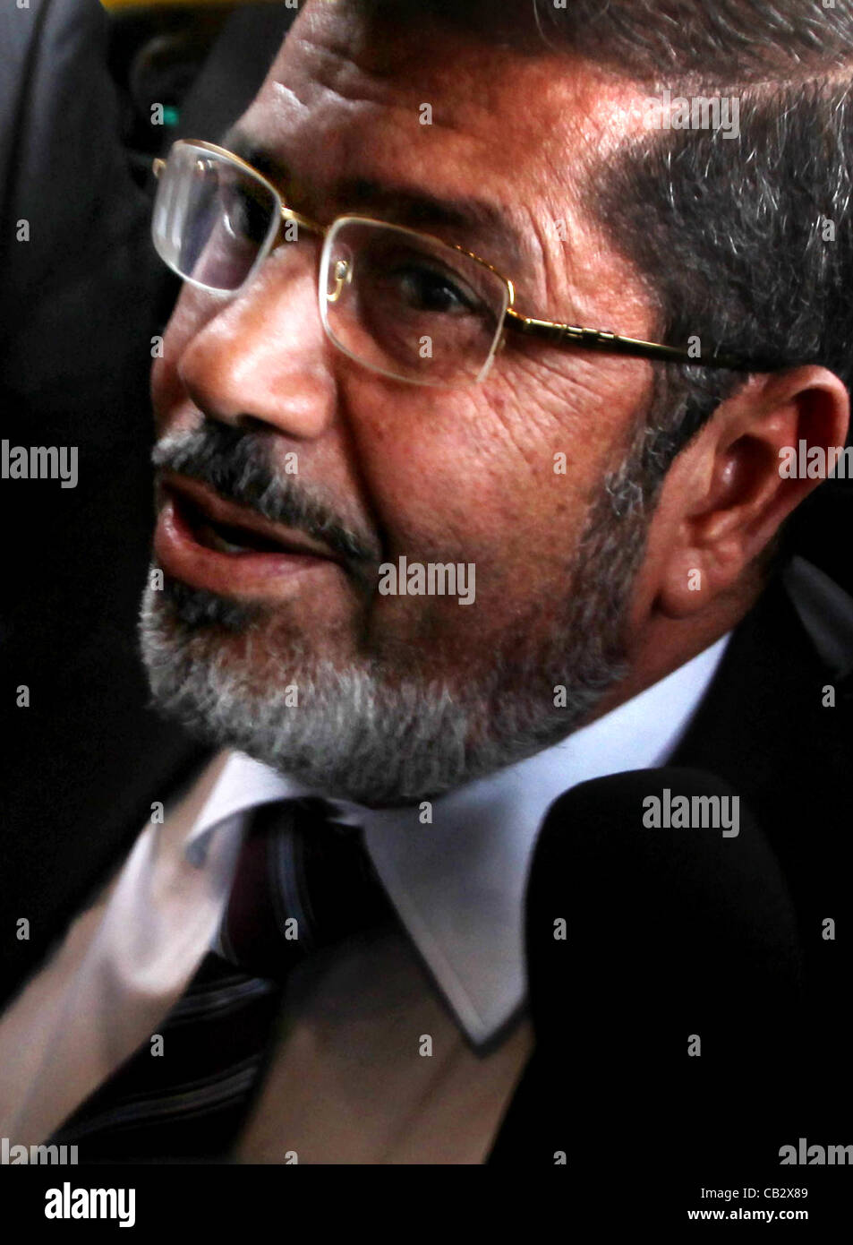 May 26, 2012 - Cairo, Egypt - Egyptian Islamist presidential candidate MOHAMED MURSI arrives to meet officials. The Muslim Brotherhood candidate and a military man close to ousted leader Hosni Mubarak courted defeated first-round candidates in Egypt's presidential election, each trying to claim the  Stock Photo