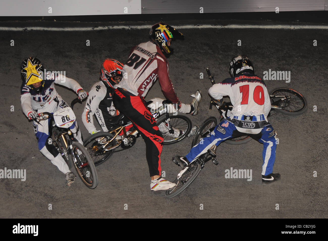 26.05.2012.  England, Birmingham, National Indoor Arena. UCI BMX World Championships. WILLERS Marc (New Zealand) crashes  along with David HERMAN, Donny ROBINSON and  Maris STROMBERGS during the Mens Elite Final. Stock Photo