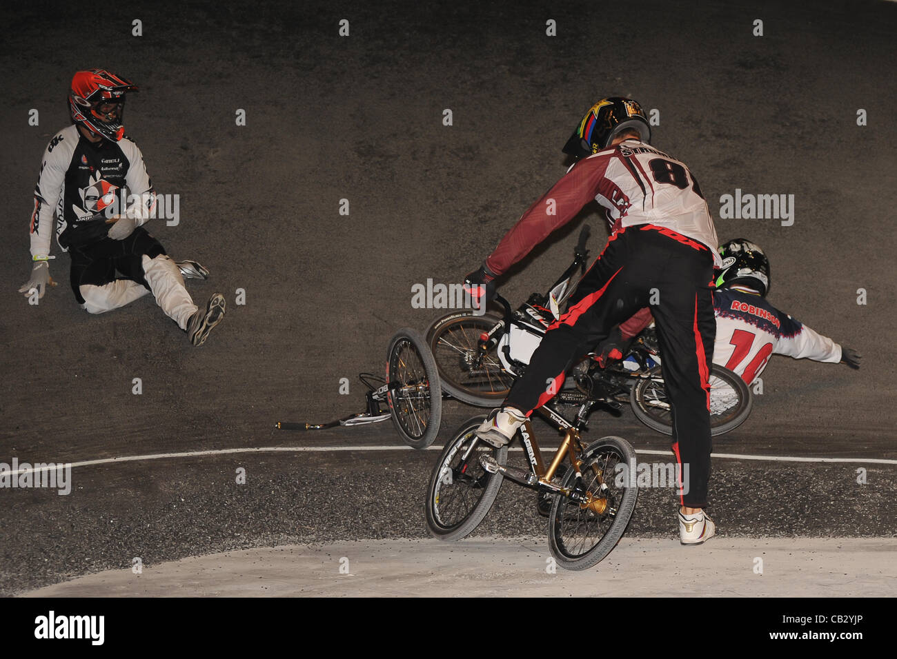 26.05.2012.  England, Birmingham, National Indoor Arena. UCI BMX World Championships. WILLERS Marc (New Zealand) crashes  along with David HERMAN, Donny ROBINSON and  Maris STROMBERGS during the Mens Elite Final. Stock Photo
