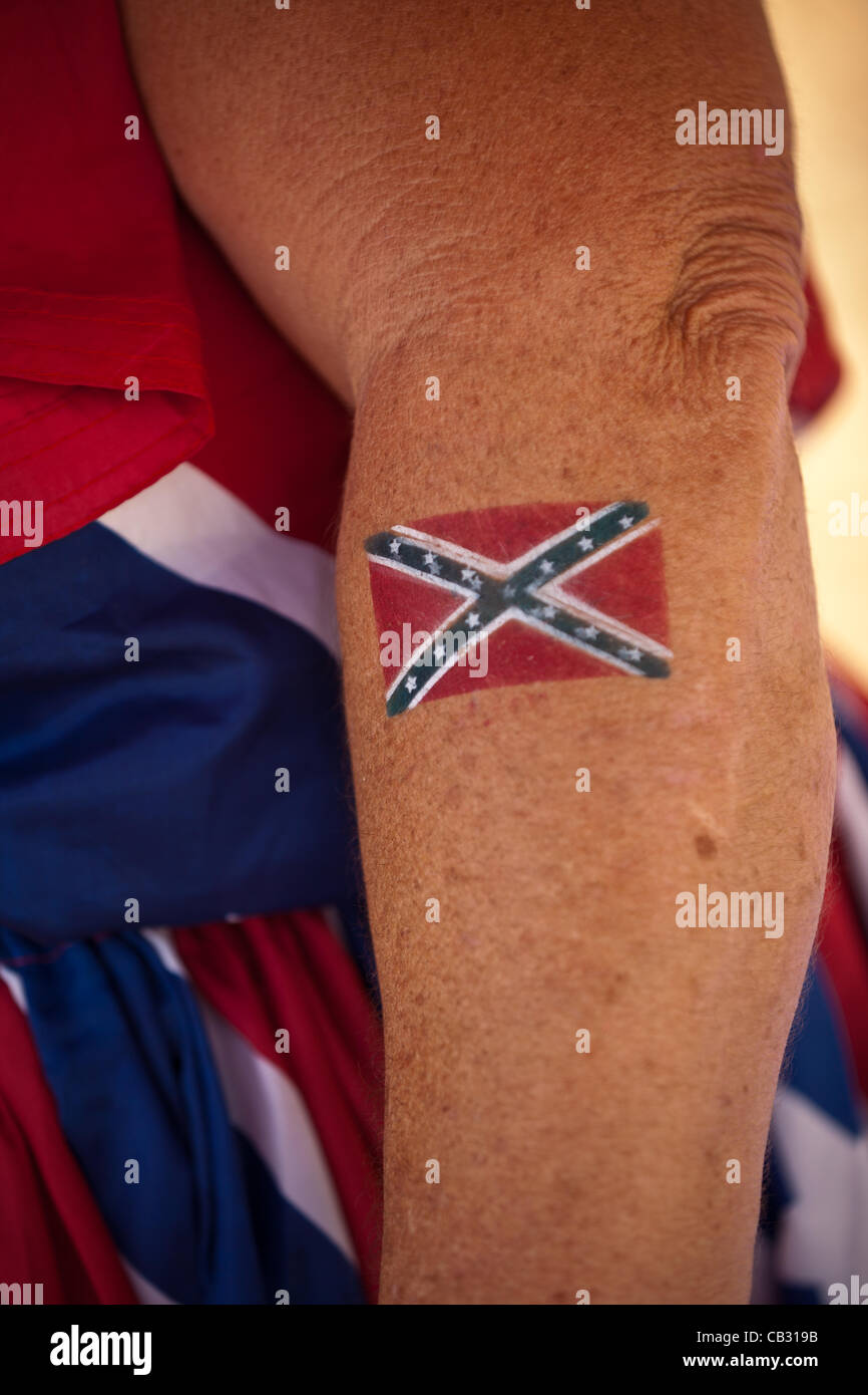 A woman shows off her confederate flag tattoo at the Summer Redneck Games on May 26, 2012 in East Dublin, Georgia.  The games honor the southern red neck culture. Stock Photo