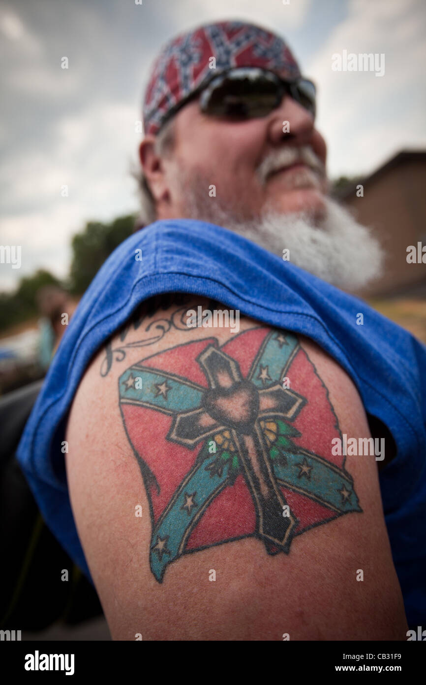 A man shows off his confederate flag tattoo at the Summer Redneck Stock.