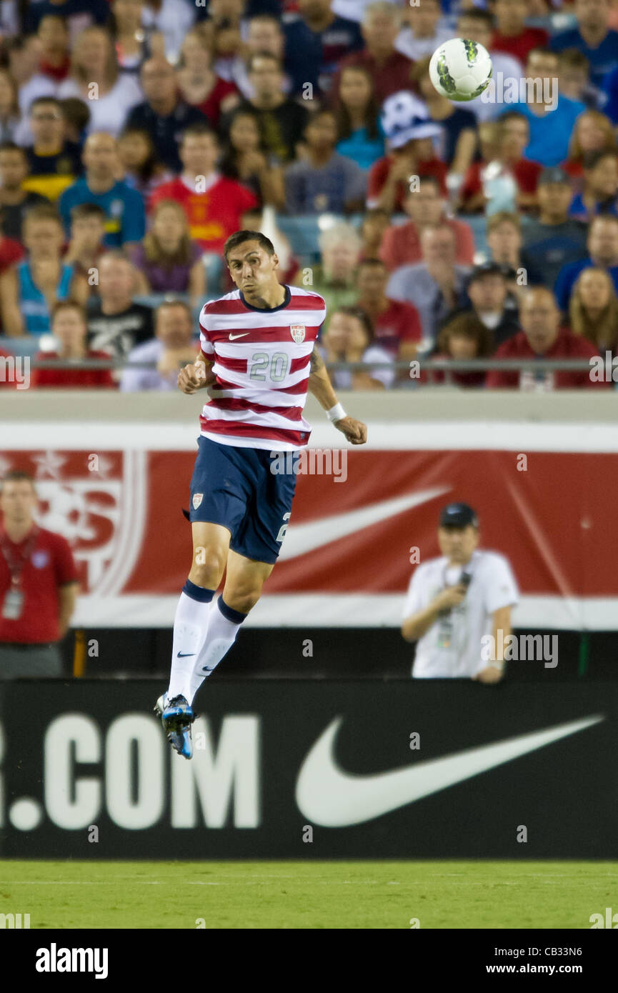26.05.2012. Jacksonville, Florida, USA.  USA's Geoff Cameron (20) leaps into the air to head the ball during the first half of play of the U.S. Men's National Soccer Team game against Scotland at Everbank Field in Jacksonville, FL. At halftime USA lead Scotland 2-1. USA ran out convincing winners by Stock Photo
