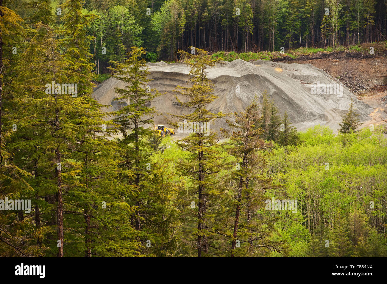 Sitka, Alaska 27 May 2012  Machinery in rock quarry at the edge of rain forest in southeast Alaska. Stock Photo