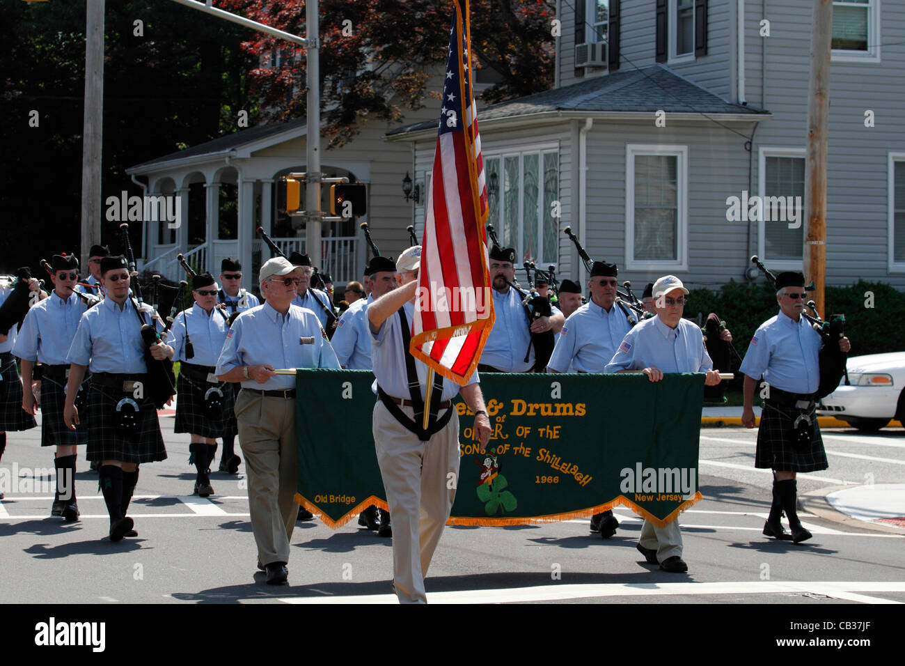 Members of the Friendly Sons of the Shillelagh, an Old Bridge, NJ USA based Drum and Bugle Corps,  marching in a Memorial Day Parade. Stock Photo