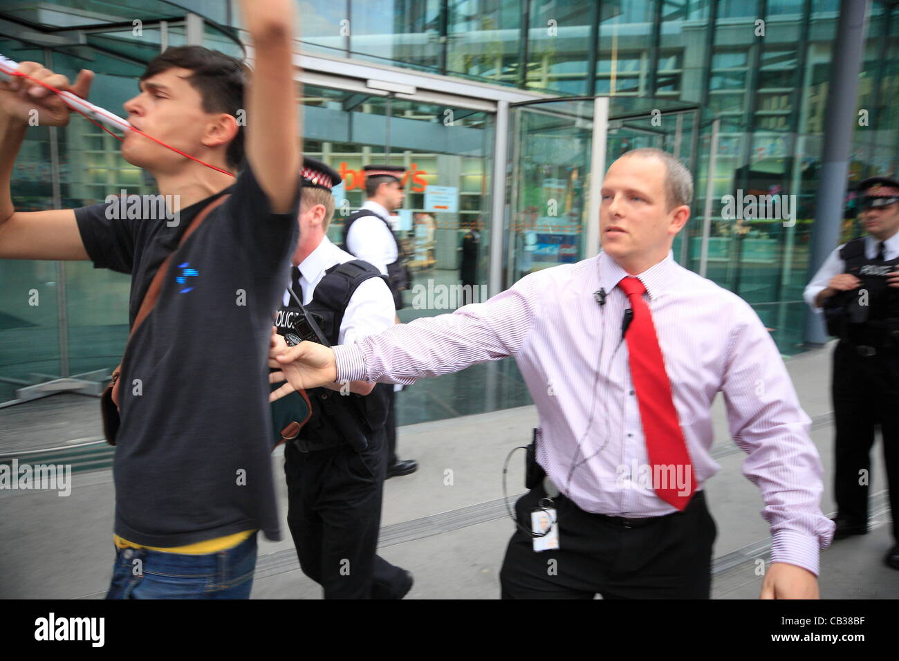 Monday 28th May 2012 Pay Up group target Sainsbury's head office as they call on the company to pay workers a living wage, security staff move in to clear protesters from the property. Credit Line : Credit:  HOT SHOTS / Alamy Live News Stock Photo