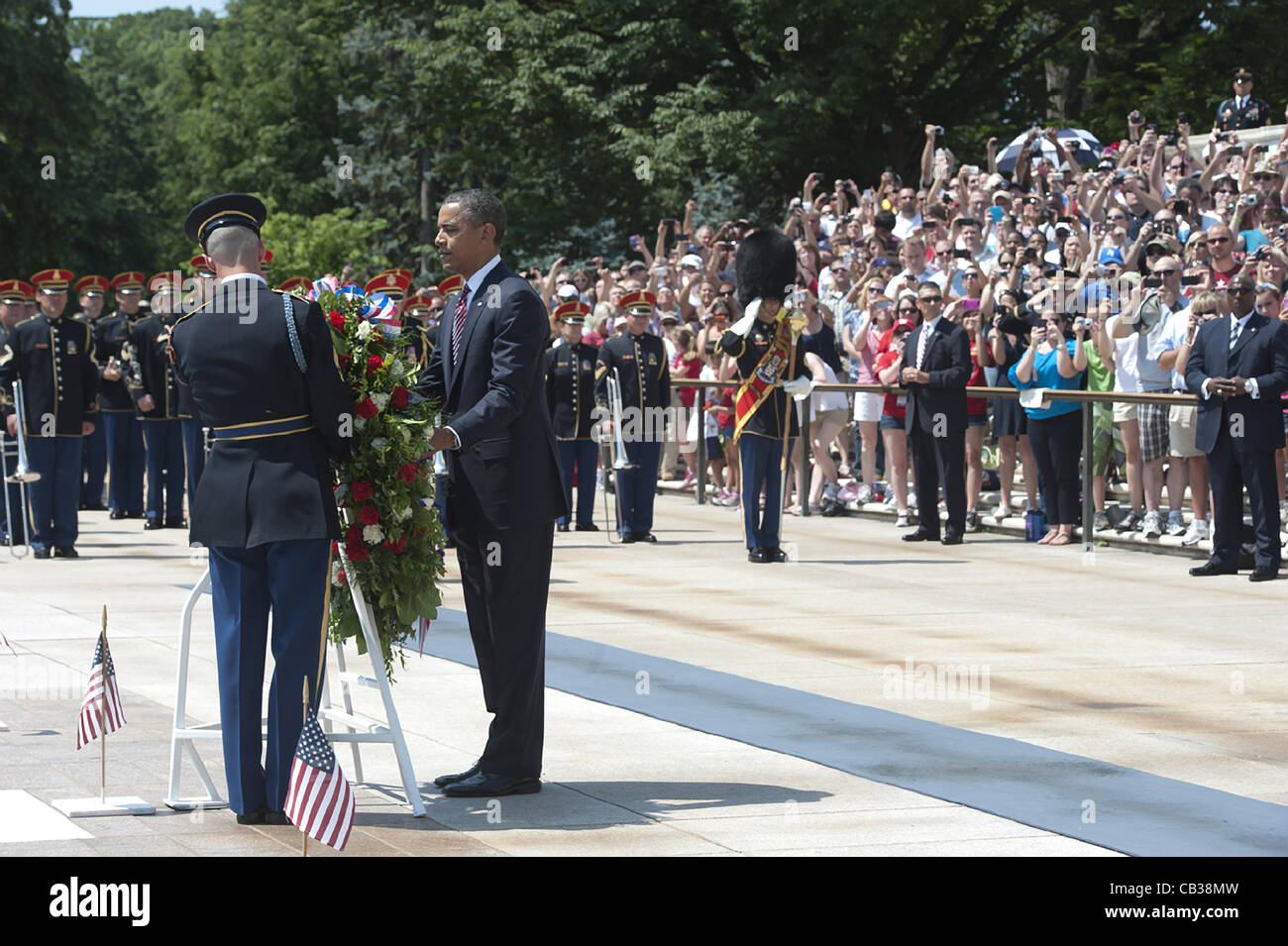 US President Barack Obama places a wreath at the Tomb of the Unknowns in honor of Memorial Day at Arlington National Cemetery May 28, 2012 in Arlington, VA Stock Photo