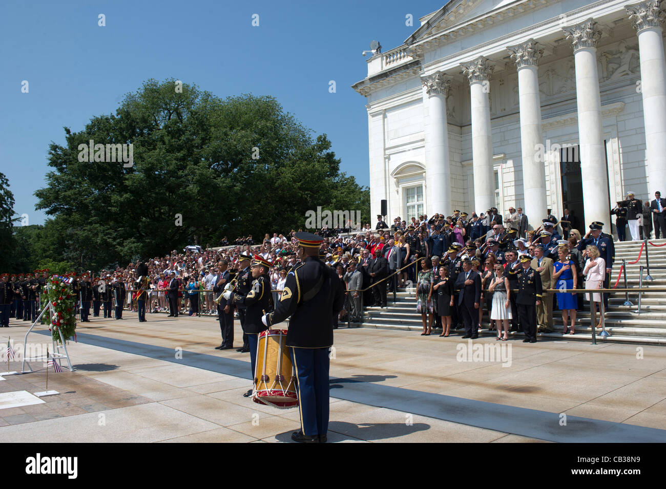 US President Barack Obama stands for a moment of silence at the Tomb of the Unknowns at Arlington National Cemetery May 28, 2012 in Arlington, VA Stock Photo