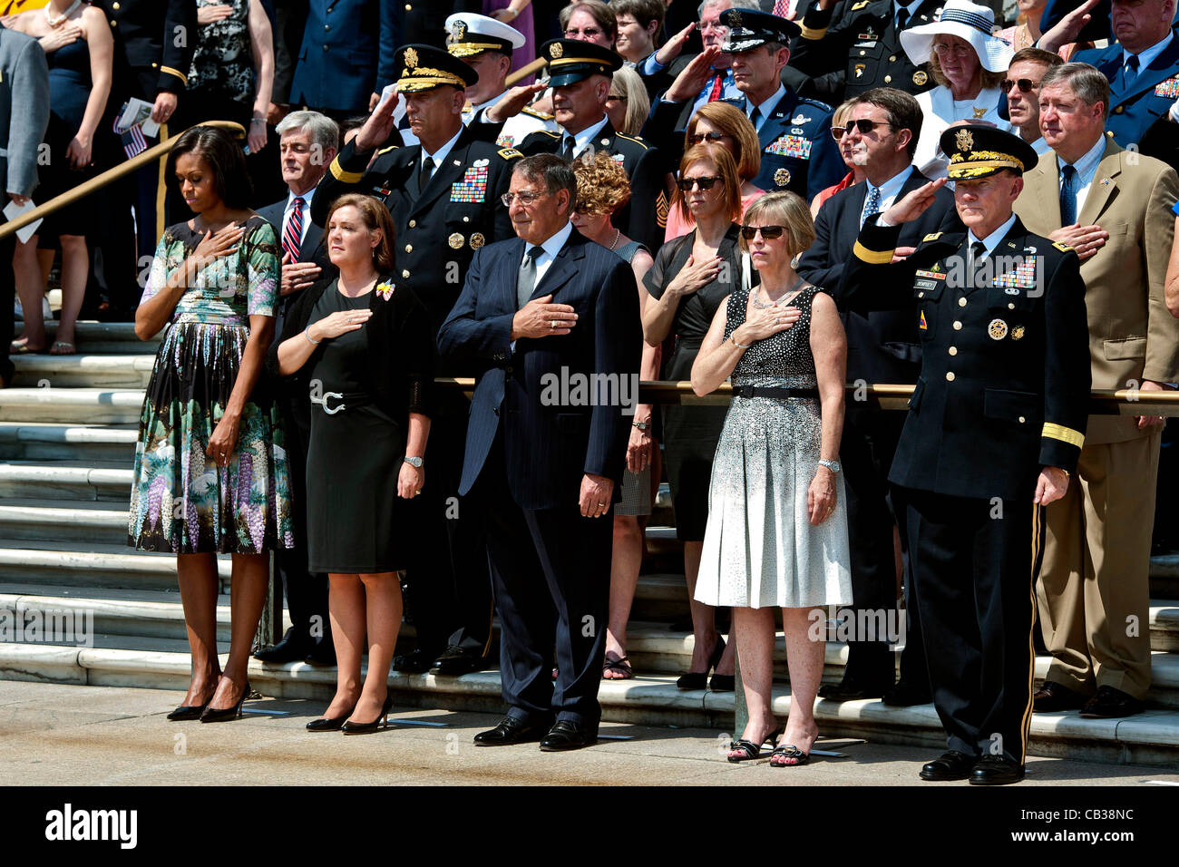 US Secretary of Defense Leon E. Panetta, center, with first lady Michele Obama, and General Martin Dempsey and his wife pause for taps during Memorial Day services at at the Tomb of the Unknowns at Arlington National Cemetery May 28, 2012 in Arlington, VA Stock Photo