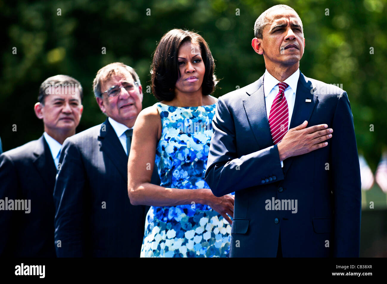 US President Barack Obama, First Lady Michelle Obama, Secretary of Defense Leon E. Panetta and Veterans Administration Secretary Eric Shinseki stand in honor at a ceremony commemorating the 50th anniversary of the Vietnam War at the Vietnam Veterans Memorial May 28, 2012 in Washington, DC. Stock Photo