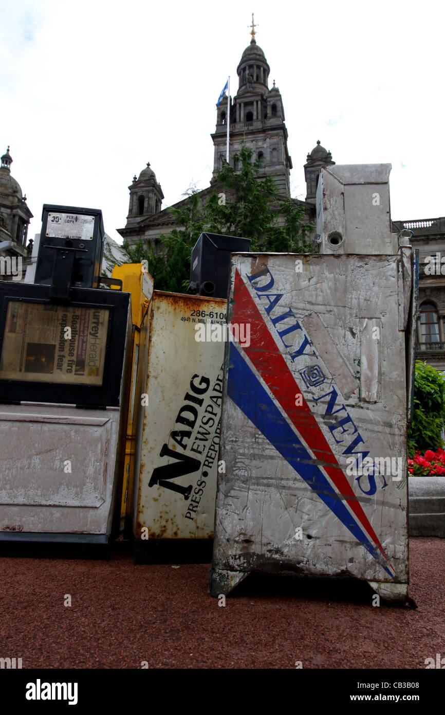 World War Z film set George Square Glasgow with dummy newspaper vending machines and City Chambers in background Stock Photo