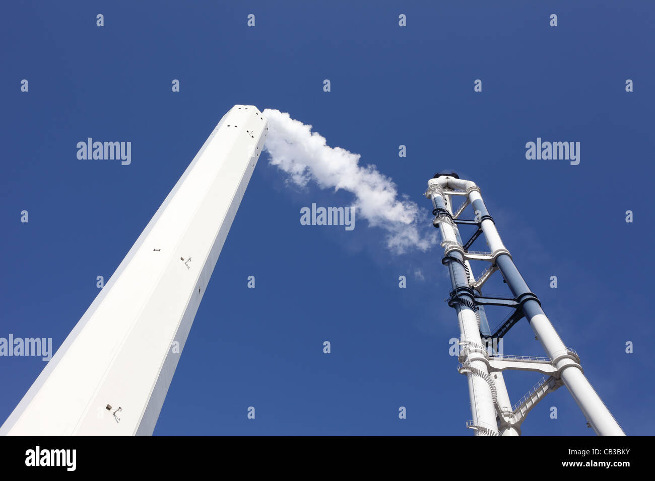 Industrial smokestack with smoke Stock Photo
