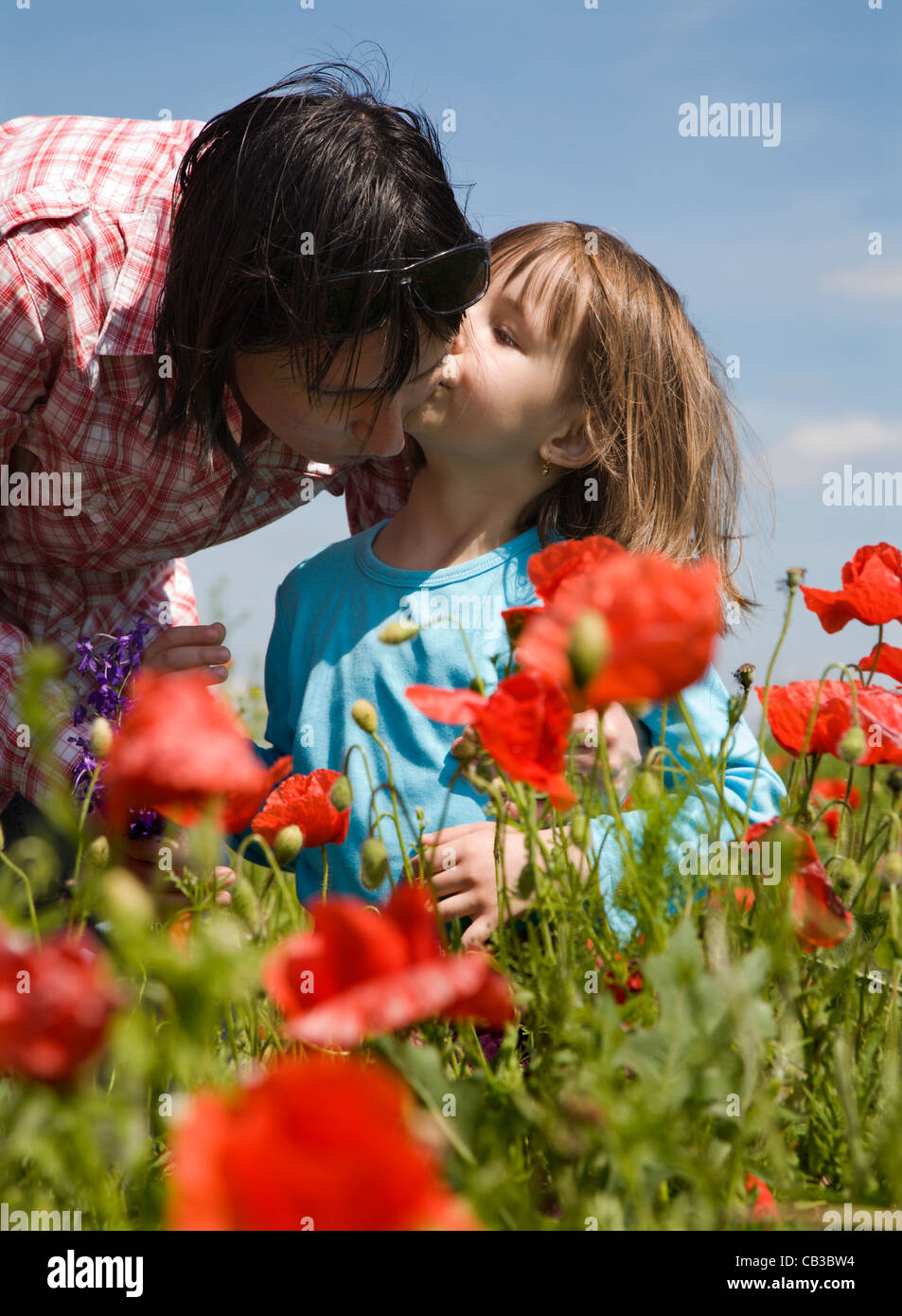 mother and daughter on the meadow Stock Photo