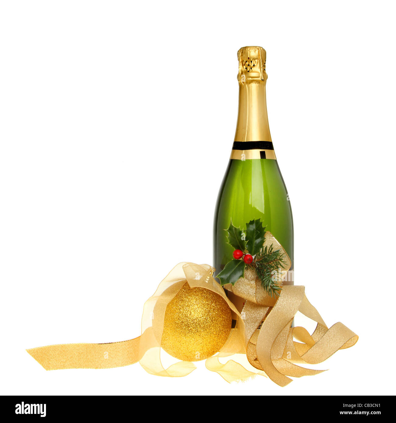 Christmas champagne bottle decorated with holly, gold ribbons and a golden bauble isolated against white Stock Photo