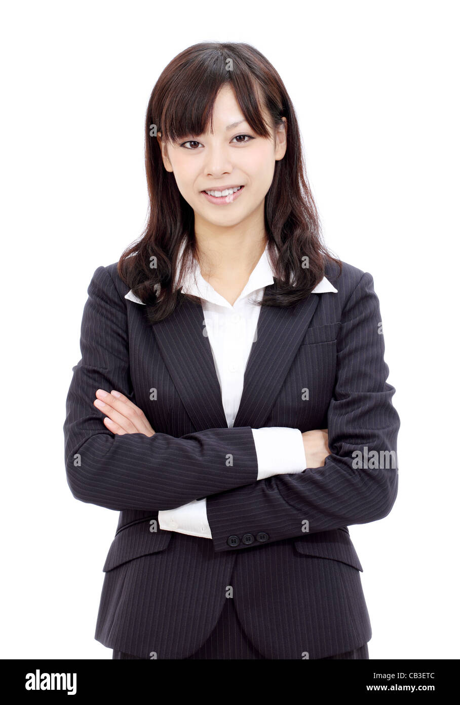 Smiling young asian businesswoman with arms crossed Stock Photo - Alamy