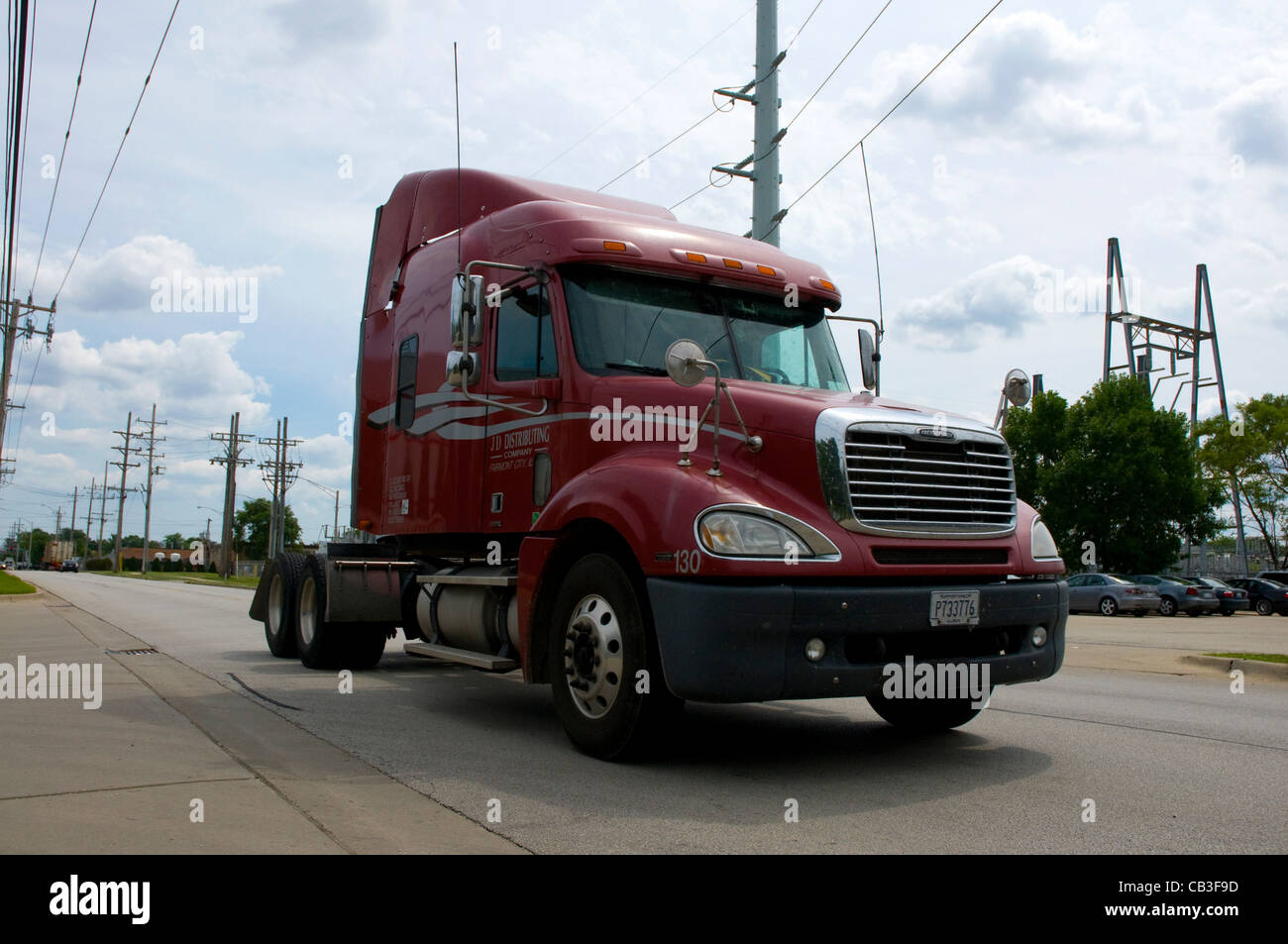 A red Haulage tractor unit driving in Chicago. Stock Photo