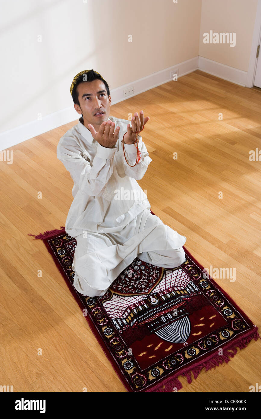 Rosary praying kneeling hi-res stock photography and images - Alamy