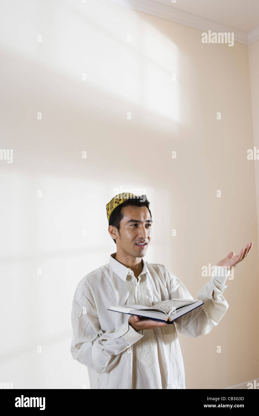 Muslim man standing praying inside hi-res stock photography and images ...