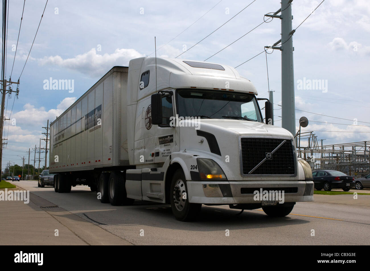 A white truck hauling cargo in Chicago. Stock Photo