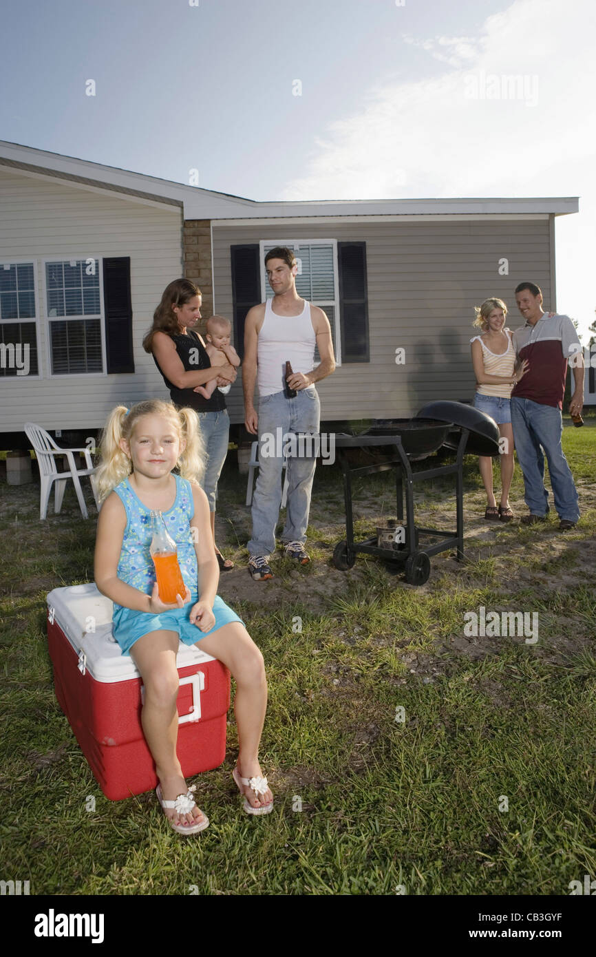 Blue collar families enjoying a cookout in front of trailer home Stock Photo Alamy