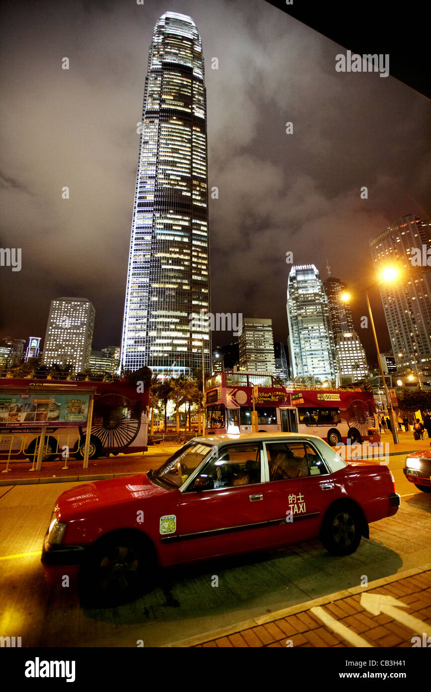 hong kong red taxi at taxi rank at night in front of international finance centre 2 on hong kong island, hksar, china Stock Photo