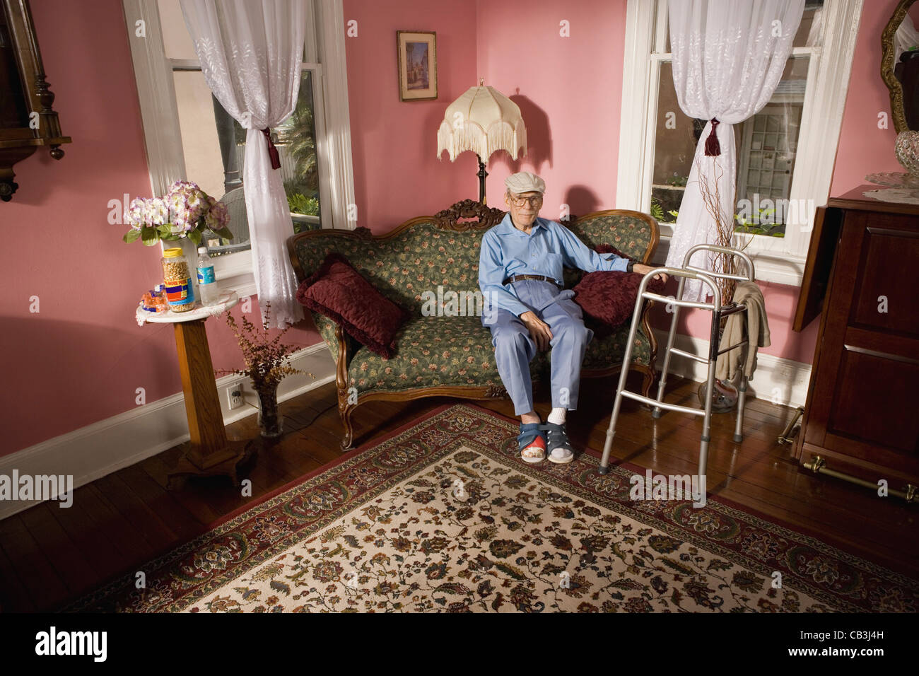 Old man sitting on walker hires stock photography and images Alamy
