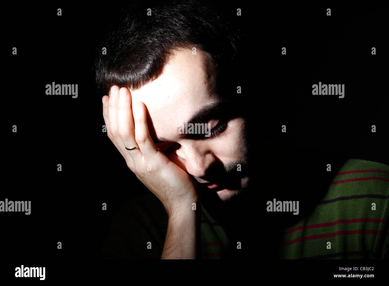 Portrait of a young man, isolated on black background Stock Photo