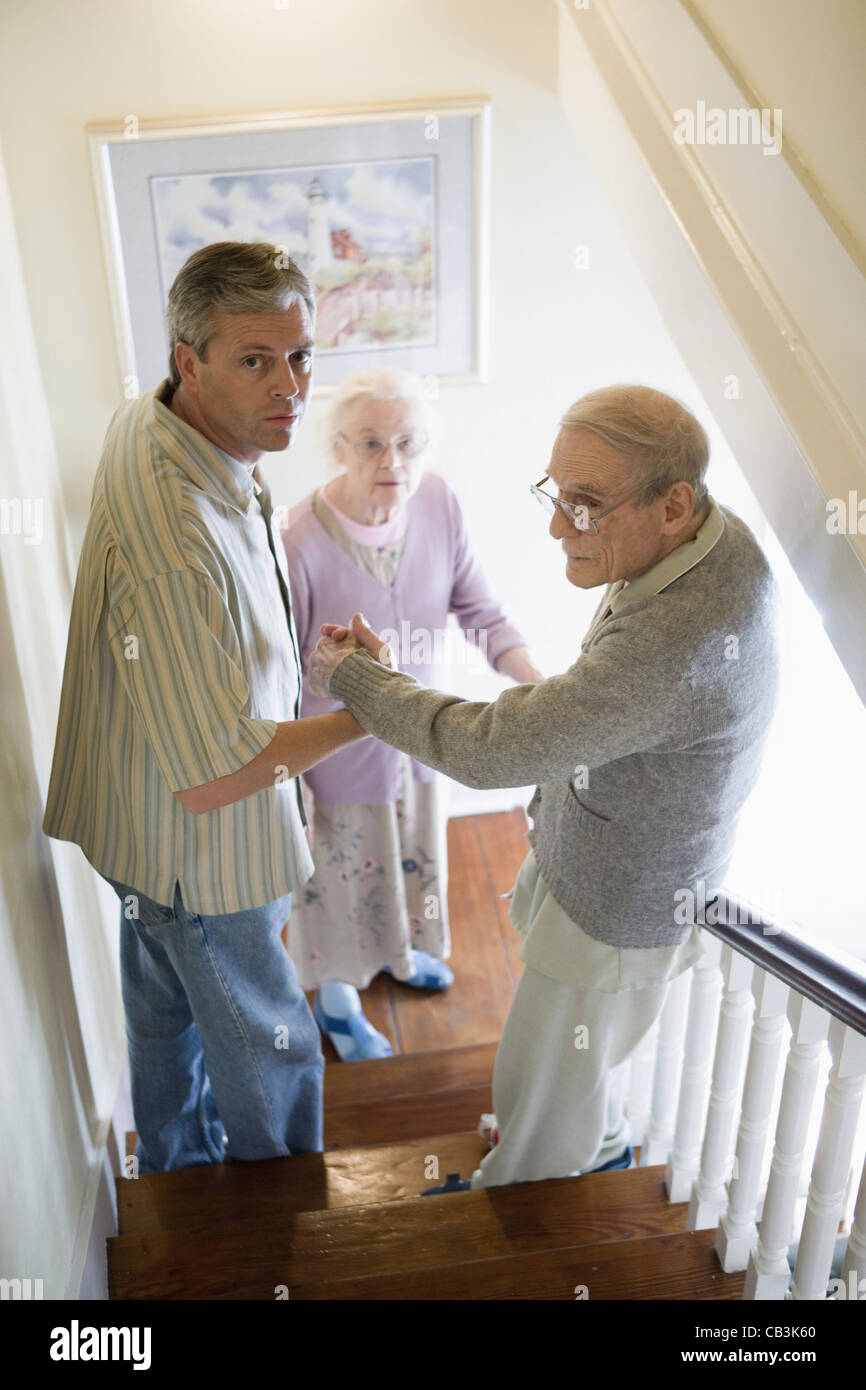Senior man stairs walking down hi-res stock photography and images - Alamy