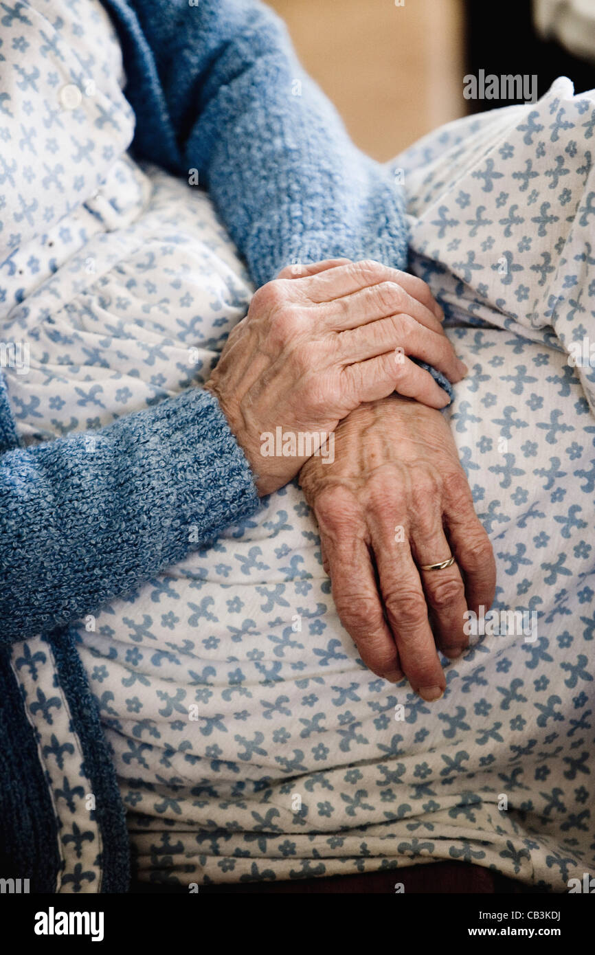 Close-up of senior woman's hands resting on her lap Stock Photo - Alamy