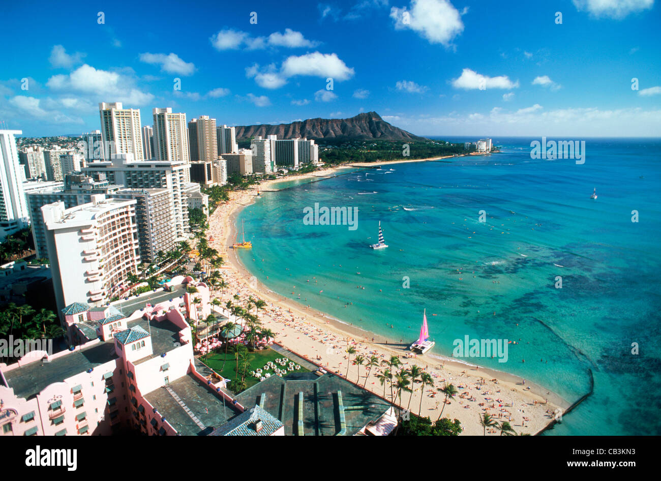 Waikiki Beach and Diamond Head with beach front hotels and catamarans