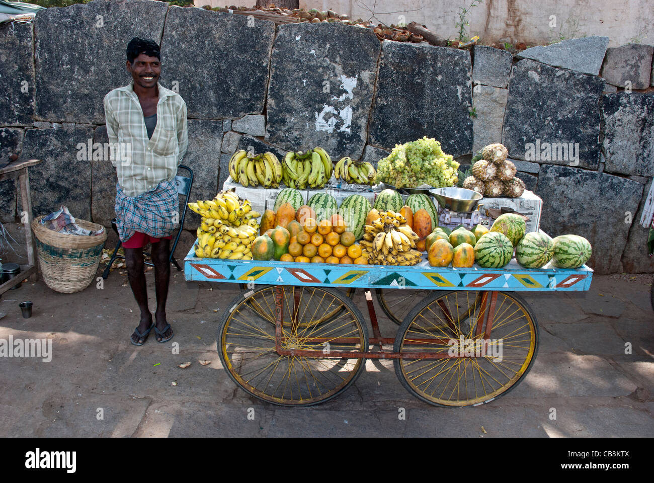 Fruit seller on a street with fruit cart, Hampi, Karnataka, India Stock