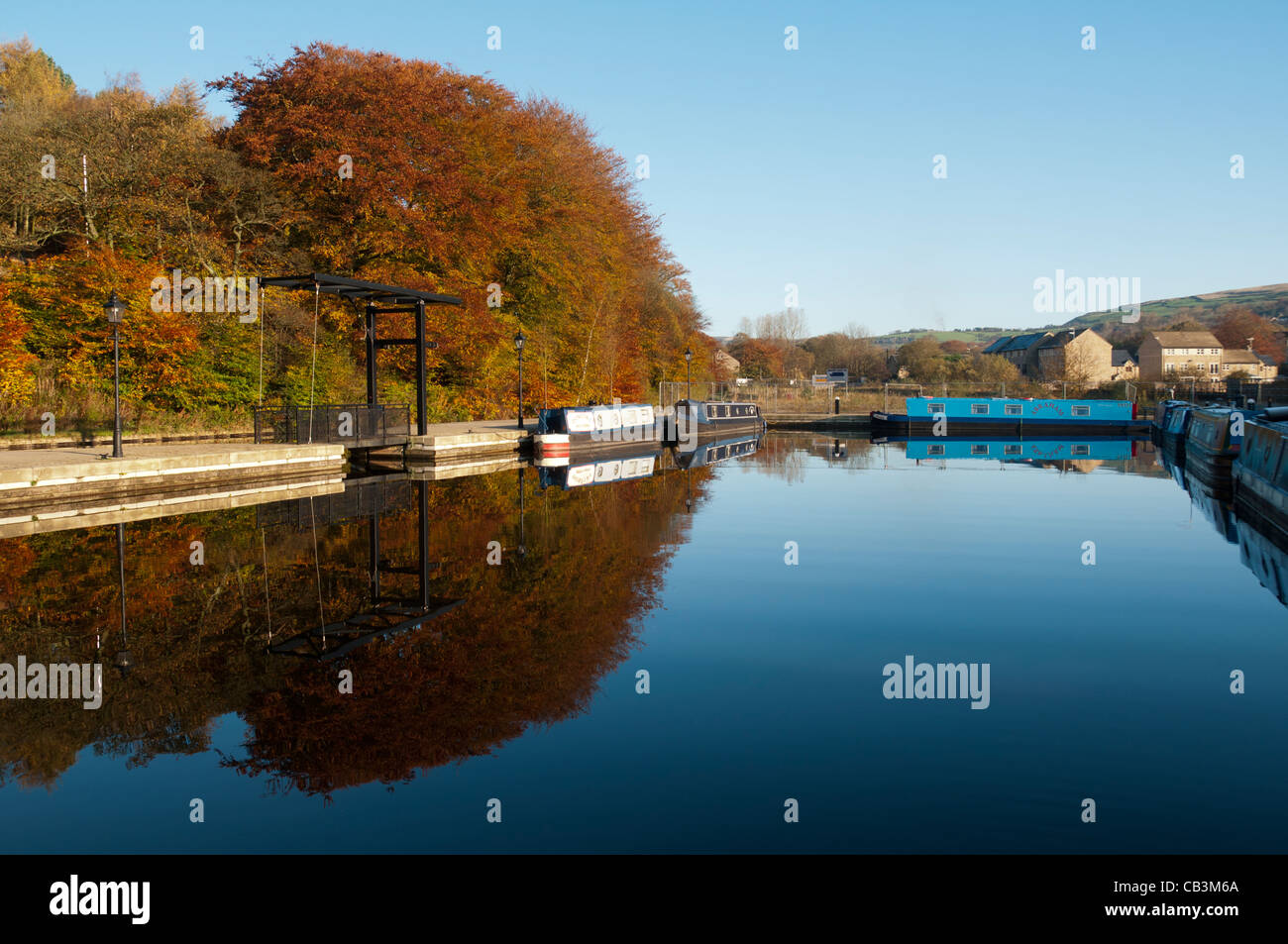 An autumn scene at Frenches Marina on the Huddersfield Narrow canal at Greenfield, Saddleworth, Greater Manchester, UK. Stock Photo