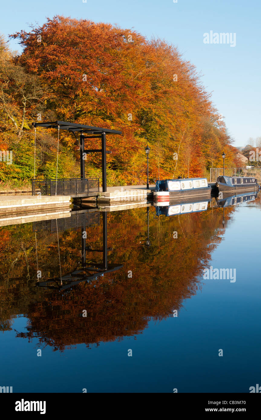 An autumn scene at Frenches Marina on the Huddersfield Narrow canal at Greenfield, Saddleworth, Greater Manchester, UK. Stock Photo