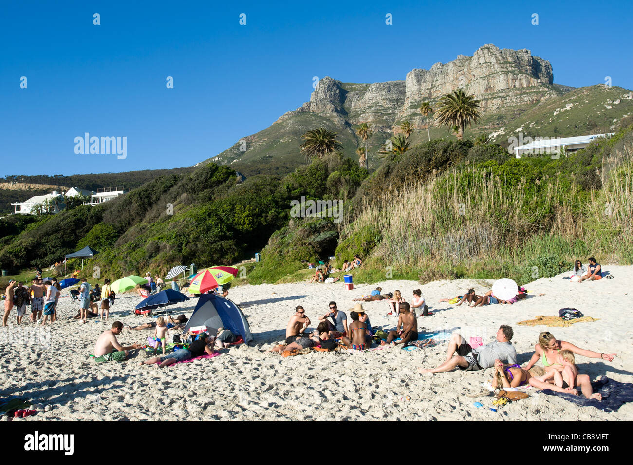 People relax at Llandudno beach Cape Town South Africa Stock Photo