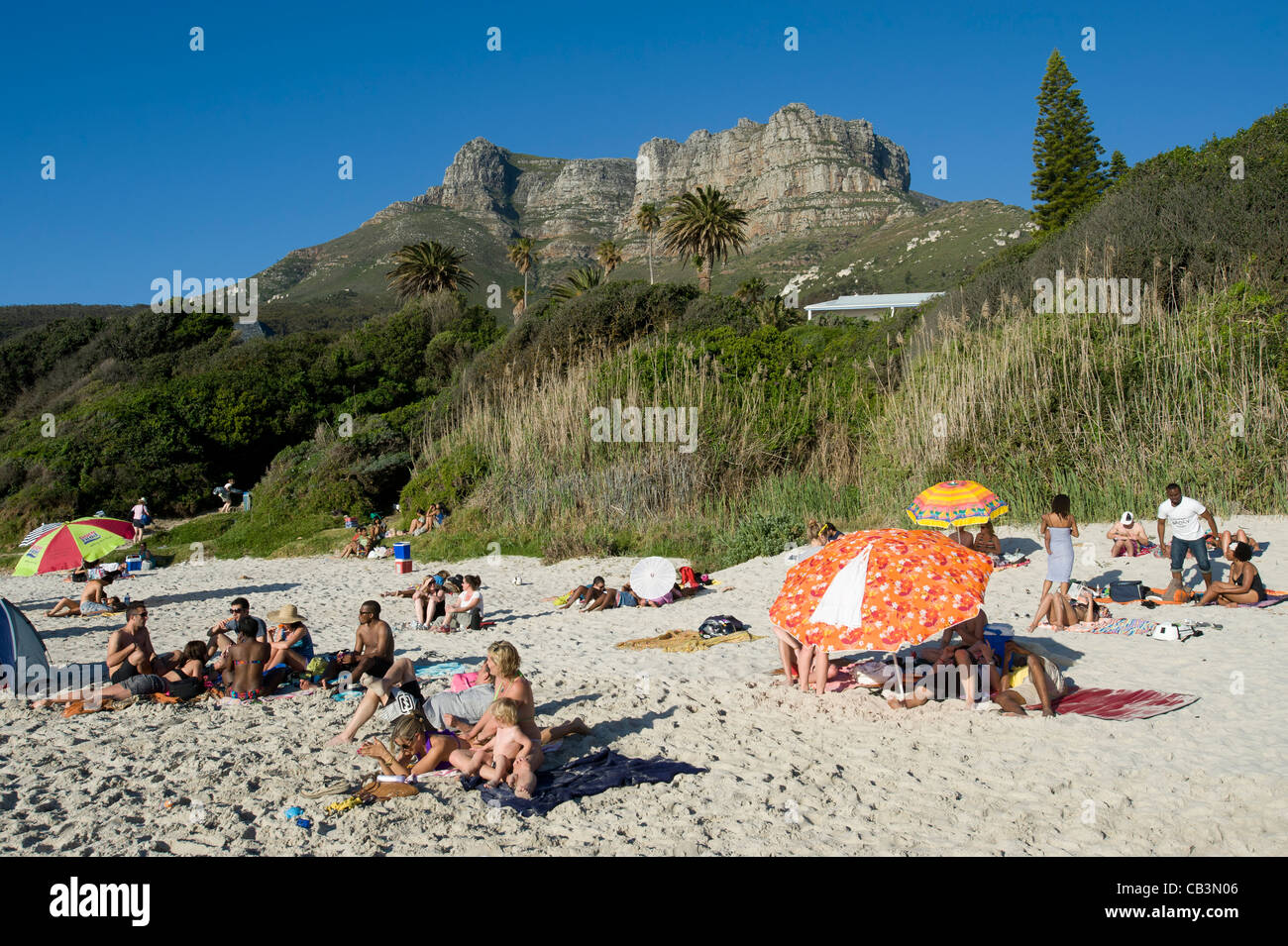 People relax at Llandudno beach Cape Town South Africa Stock Photo