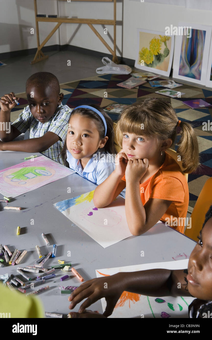 Young students sitting in art class Stock Photo - Alamy
