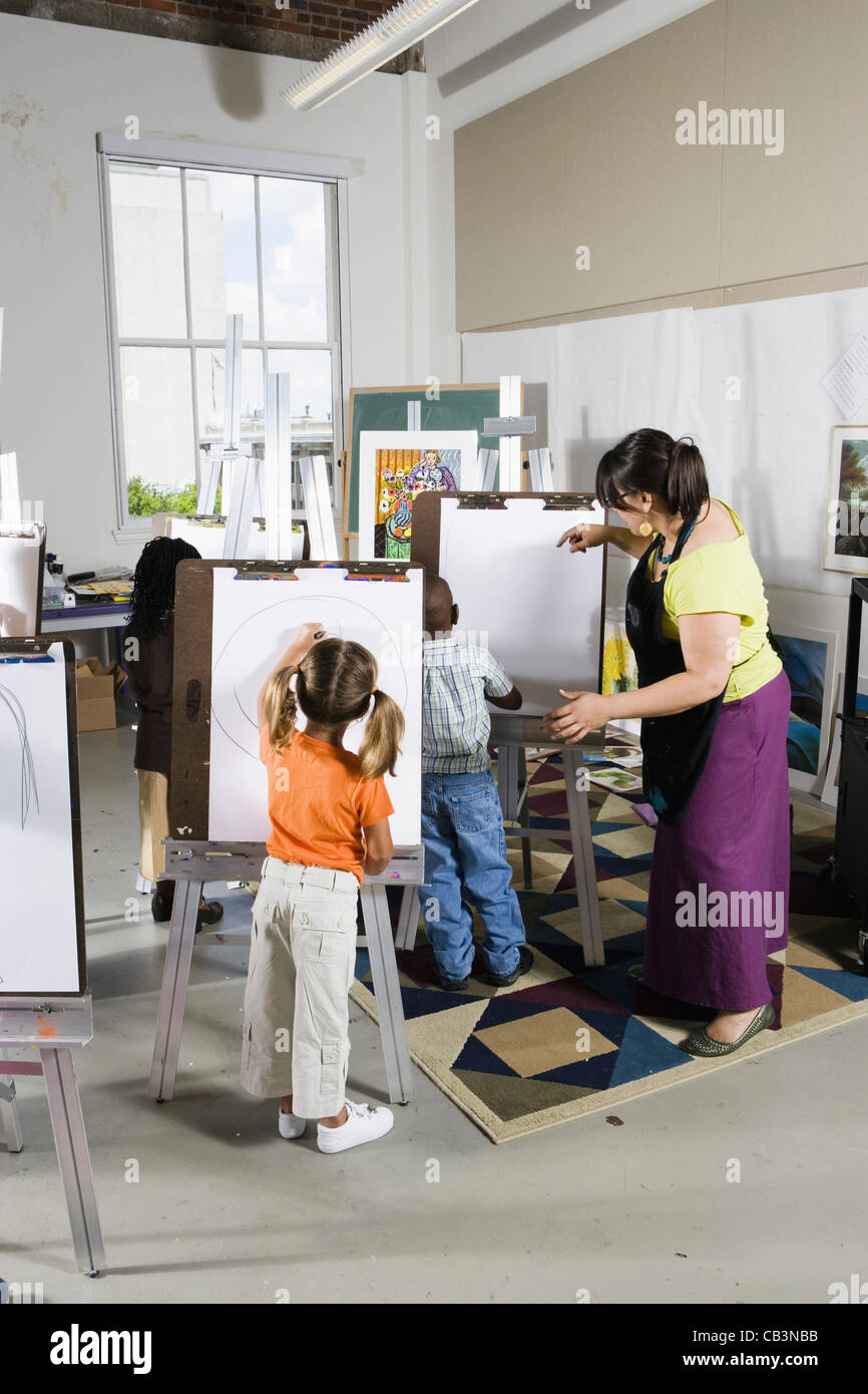 An art teacher teaching students in a classroom Stock Photo Alamy
