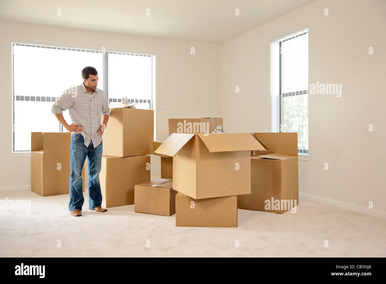 Man moving into new house Stock Photo Alamy