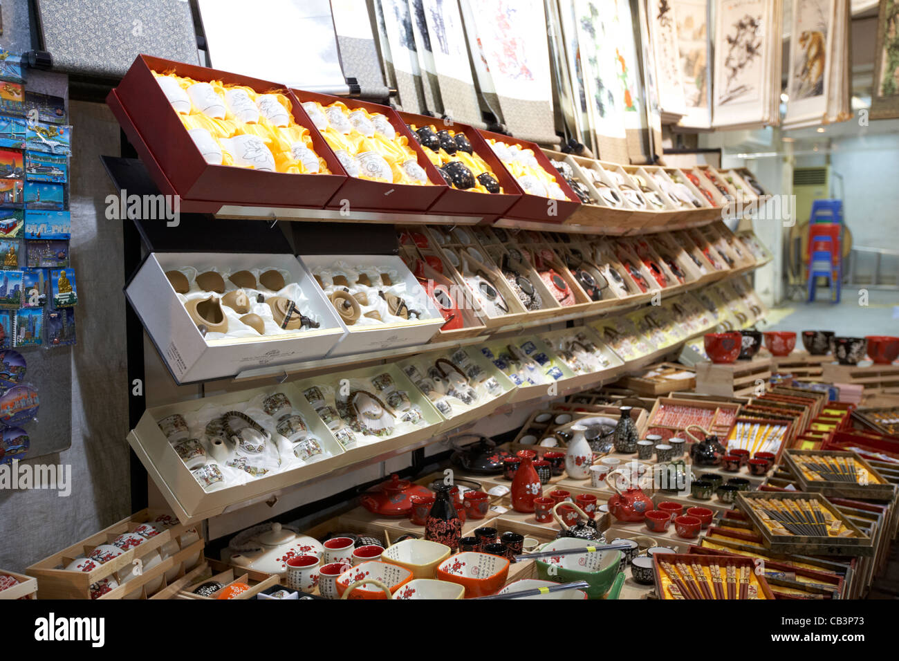 chinese tea sets on a tourist souvenir stall at temple street night