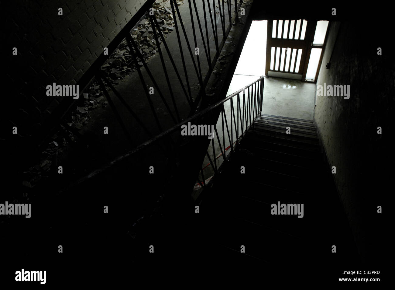 Dark forbidding staircase in rundown block of flats Stock Photo
