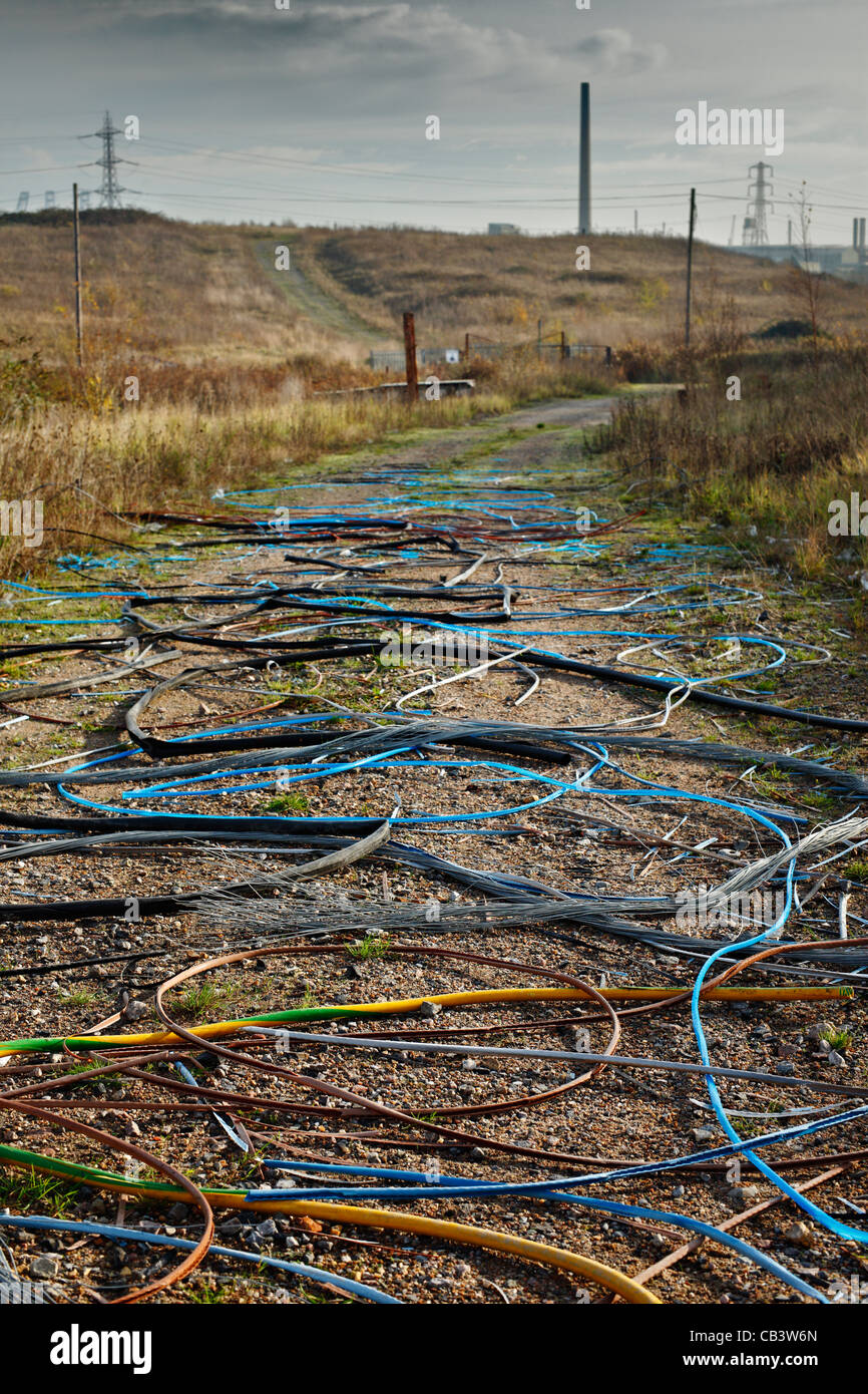 Site of discarded outer cables, after criminals have stripped out the copper metal. Stock Photo