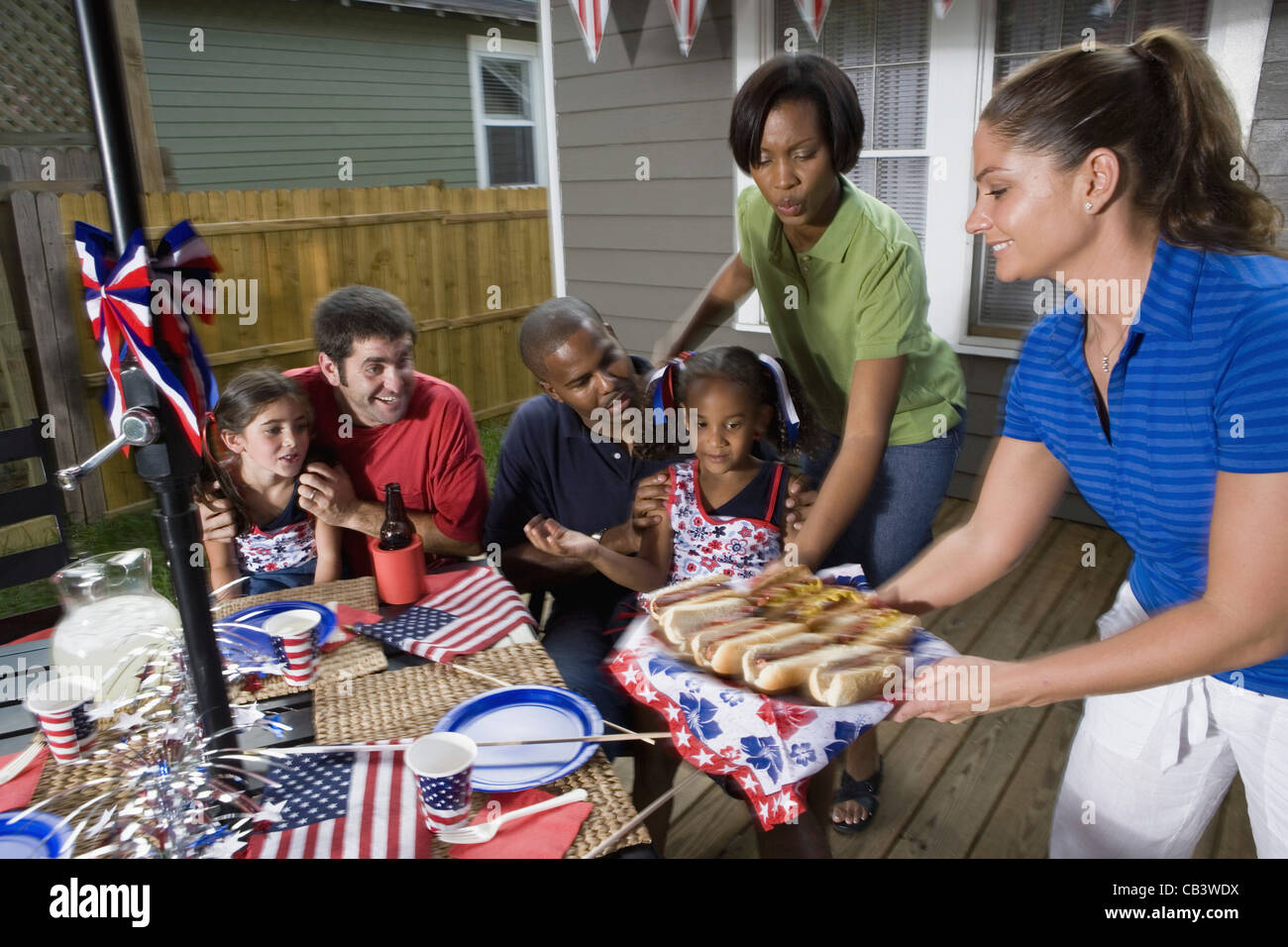 Family friends enjoying backyard cookout hi-res stock photography and  images - Alamy