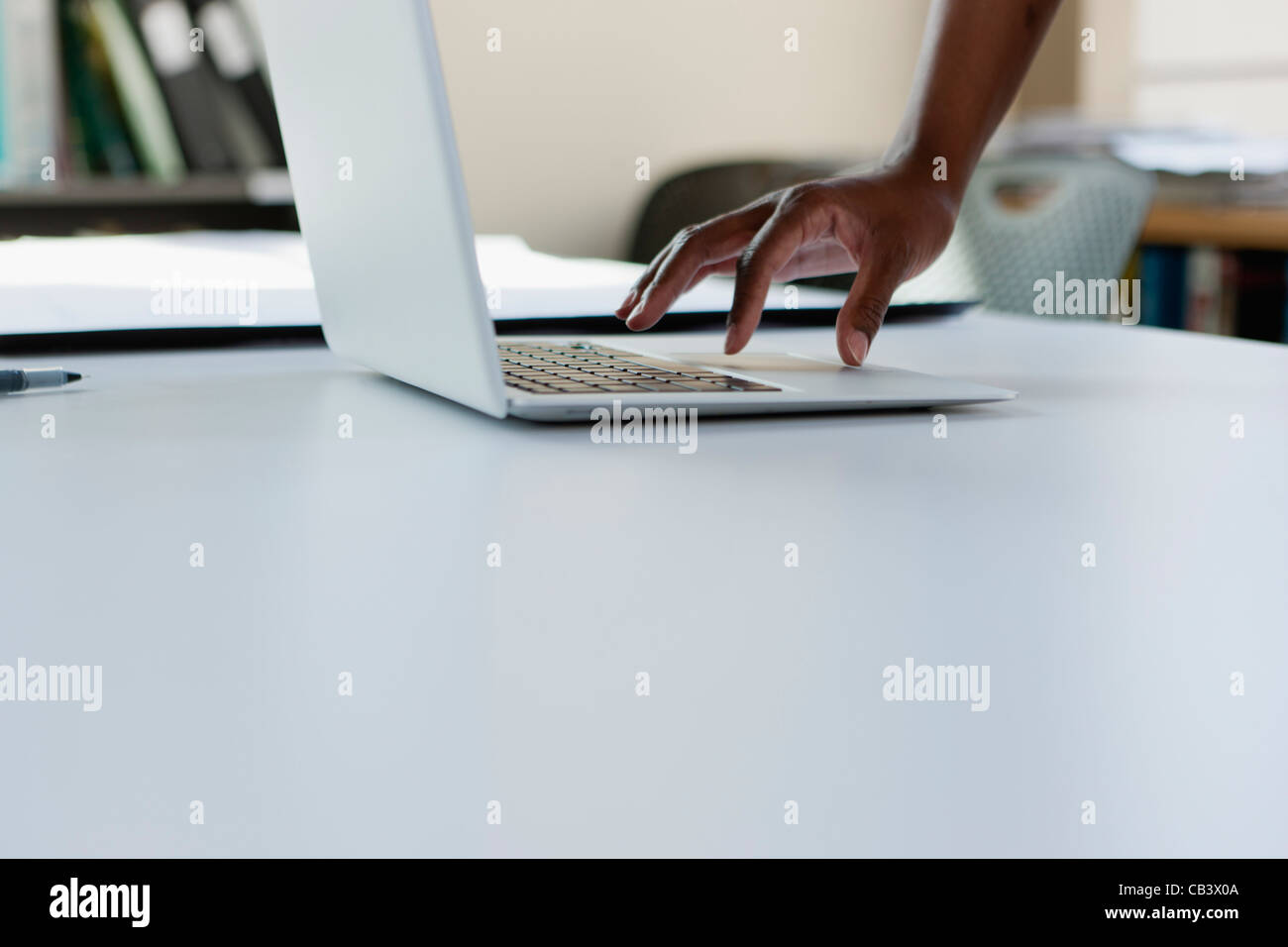 Woman's hands on computer Stock Photo - Alamy