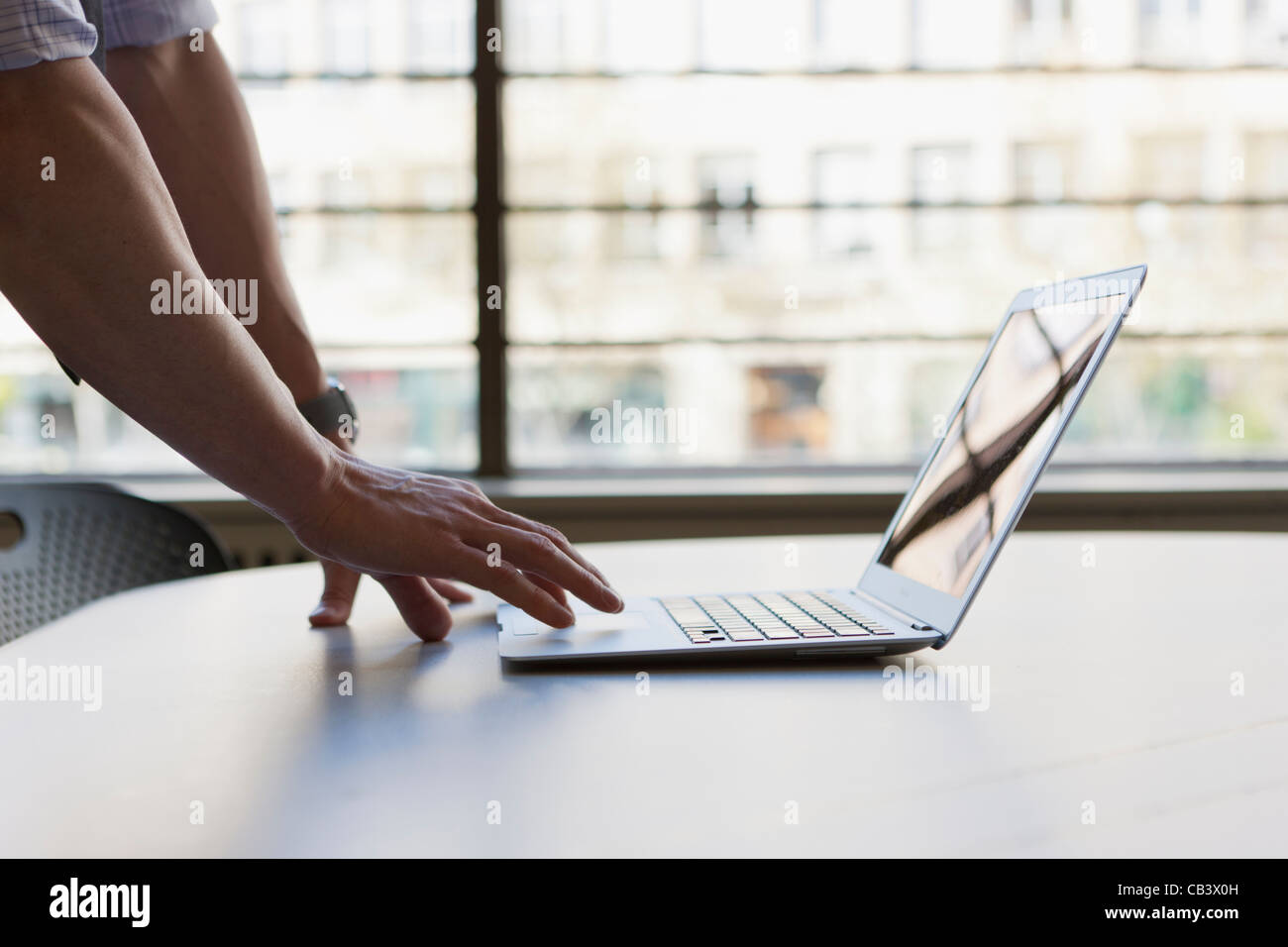 Man's hands on computer Stock Photo - Alamy