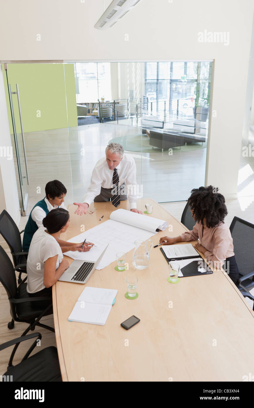 Projects Discussion Area Project discussions amongst employees in boardroom Stock Photo - Alamy